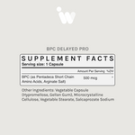 White bottle of InfiniWell BPC Delayed Pro delayed-release peptide supplement, front label