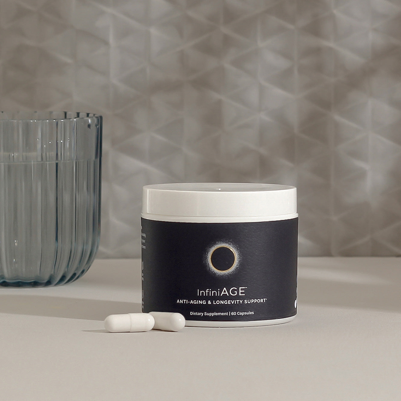 Anti-aging supplement jar with two capsules, 60 servings.