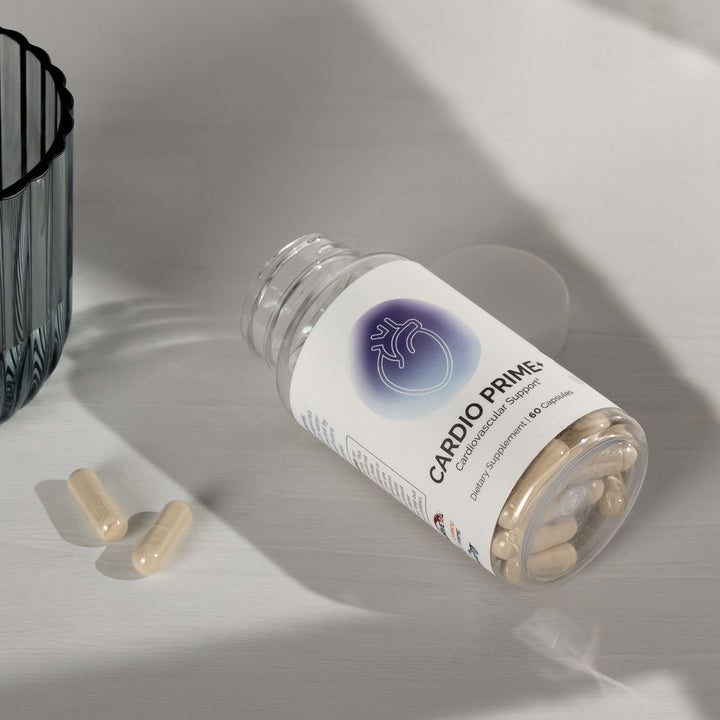 Cardiovascular support supplement capsules in a clear bottle, spilled on a white surface.
