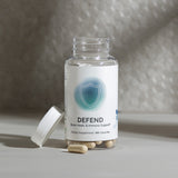 Supplement bottle showcasing bone, heart, and immune support capsules.
