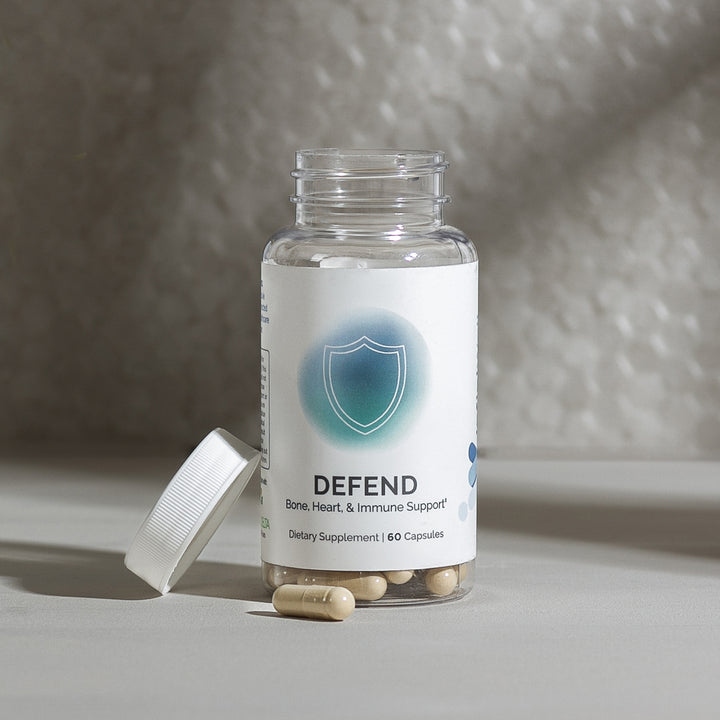 Supplement bottle showcasing bone, heart, and immune support capsules.
