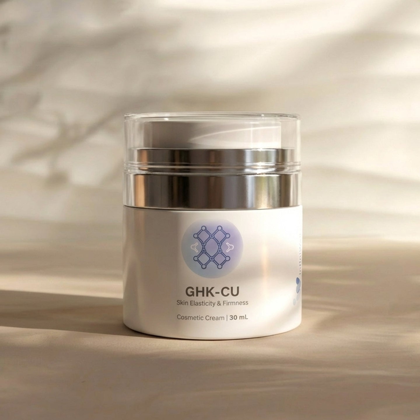 Infiniwell GHK-CU cosmetic cream jar for skin elasticity and firmness, 30 mL, on beige textured background